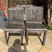 Photo of free Pair of teak garden chairs (Bramley GU5) #1
