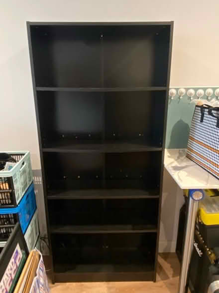 Photo of free Black bookcase - works but tired (Sydenham SE26) #1