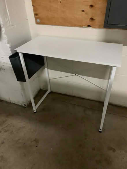 Photo of free Small white desk * earliest pickup (16 Street & First Ave Manhatta) #1