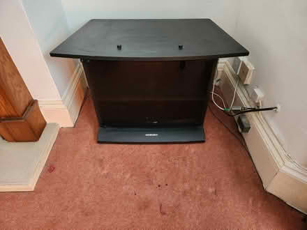 Photo of free Black TV Stand w/ glass front panel (SE2) #1