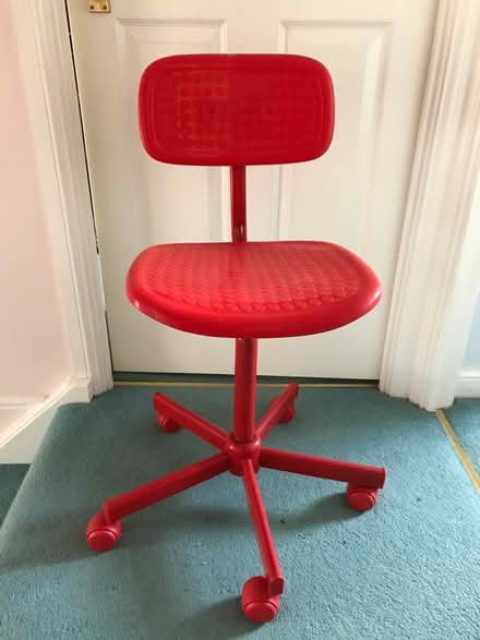 Photo of free Red plastic desk chair on castors (west Maidstone ME16 8) #1