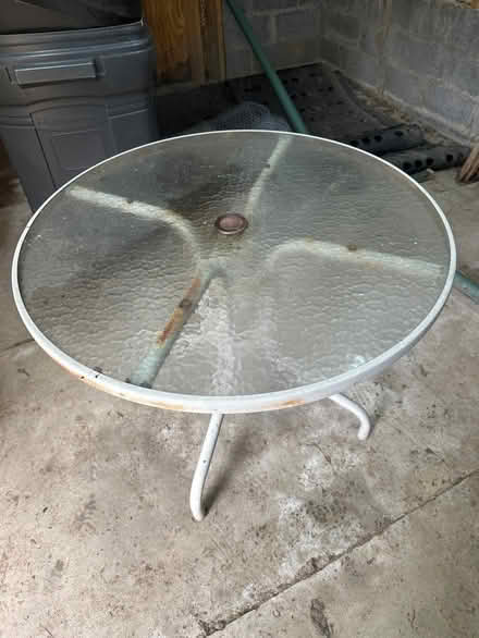 Photo of free Glass outdoor patio table 36” (Tanley Rd & New Hampshire Ave) #1