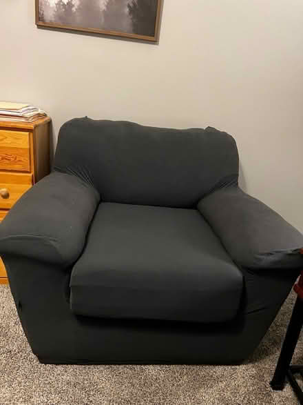 Photo of free Faux leather chair w/grey slipcover (Columbus, NC) #1