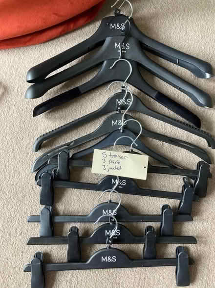 Photo of free 11 black plastic coat hangers (Abbeville Village SW4) #1