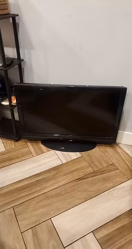 Photo of free TV with own stand - approx 42" (US19 & Nursery Road) #1