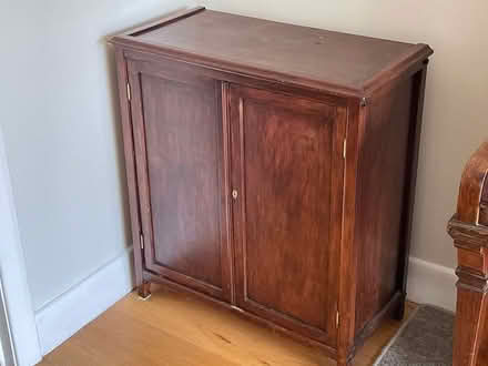Photo of free Darkwood Storage Cupboard (NW Chichester) #1