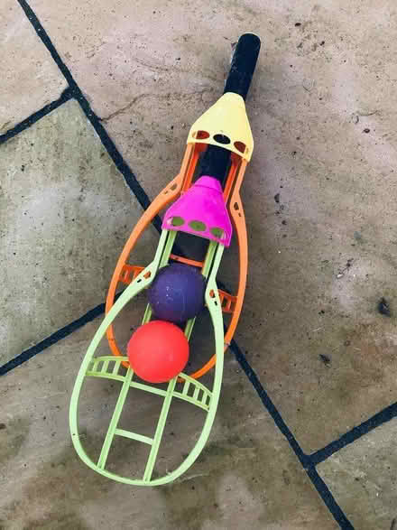 Photo of free 2 kids plastic balls with throwers/catchers (Heswall CH60) #1