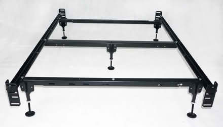 Photo of free Metal queen size bed frame (Downtown Howell) #1