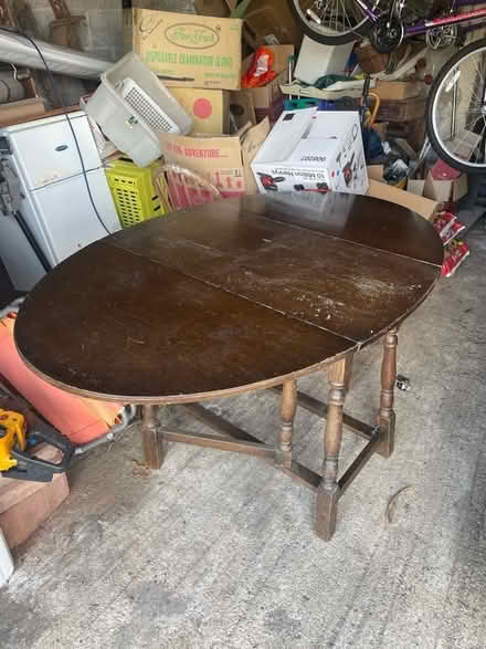 Photo of free Large drop leafed table (burton bradstock) #2