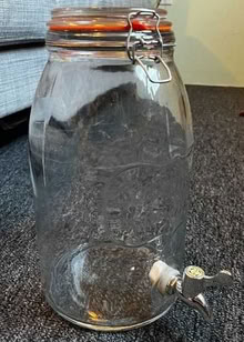 Photo of Clear glass jug, spigot near bottom (San Francisco, Twin Peaks) #1
