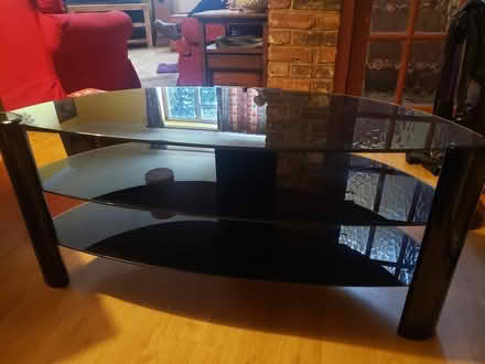 Photo of free Black glass TV stand (Forest Green) #1