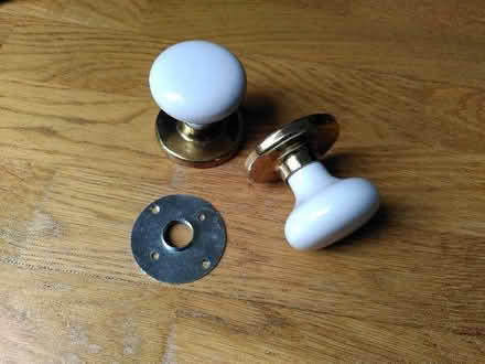 Photo of free 2 brass and white doorknobs (Seaford BN25) #1