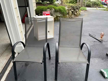 Photo of free Two outdoor stackable chairs (between Dascomb and Clark Road) #1
