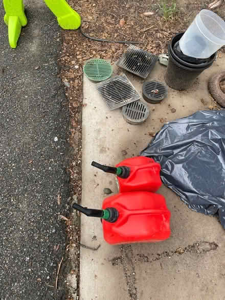 Photo of free Drain grates and gas cans (North Michigan park)
