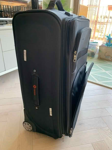 Photo of free Black large suitcase (Hackney E8) #1