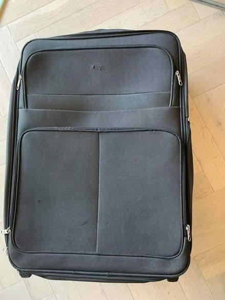 Photo of free Black large suitcase (Hackney E8) #2
