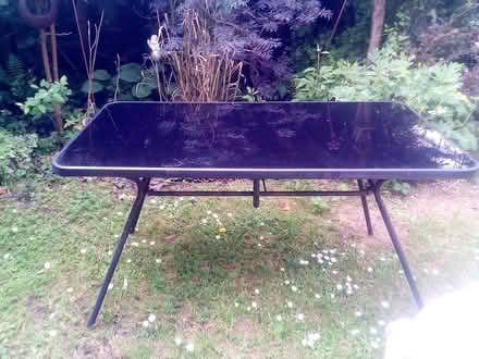 Photo of free Black glass topped garden table (Beechwood) #1