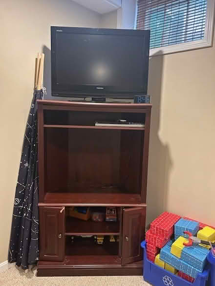 Photo of free Brown TV Stand/Cabinet (North Medford) #1