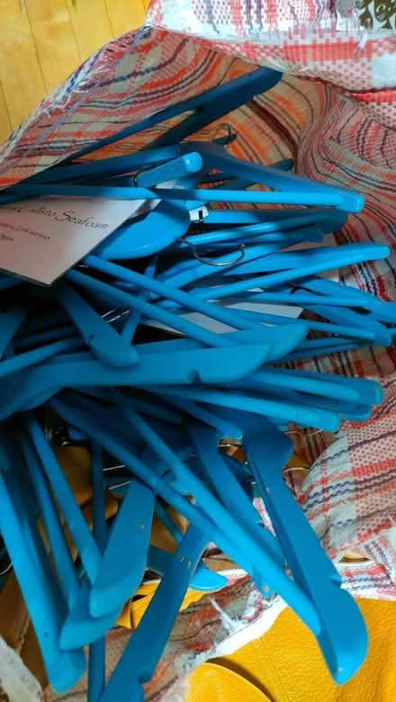 Photo of free Lots of wooden coat hangers, mostly blue (Bare LA4) #1