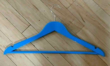 Photo of free Lots of wooden coat hangers, mostly blue (Bare LA4) #2