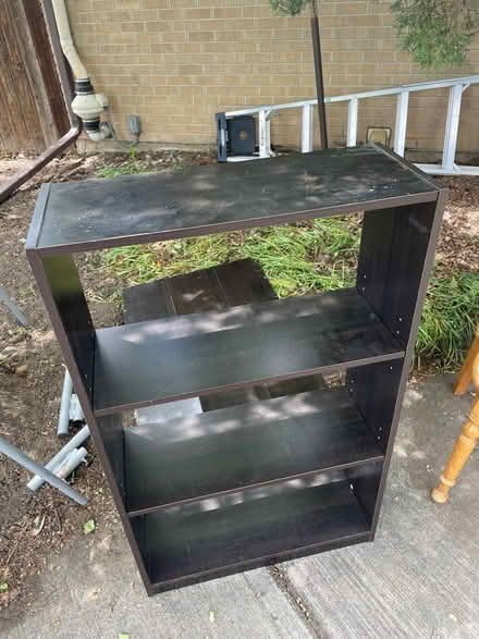 Photo of free Black particle board bookcase (South Boulder) #1