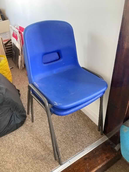 Photo of free Set of 4 stackable blue plastic chairs (Lewes BN7) #1
