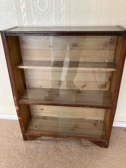Photo of free Wood cabinet, glass sliding doors (Yaxley) #1