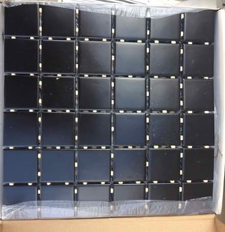 Photo of free 2 new boxes of black tiles (St. Laurent north) #1