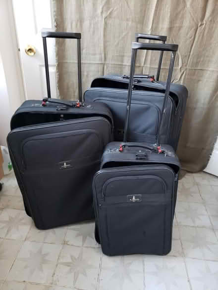 Photo of free 3 nesting rolling suitcases (Petworth) #1