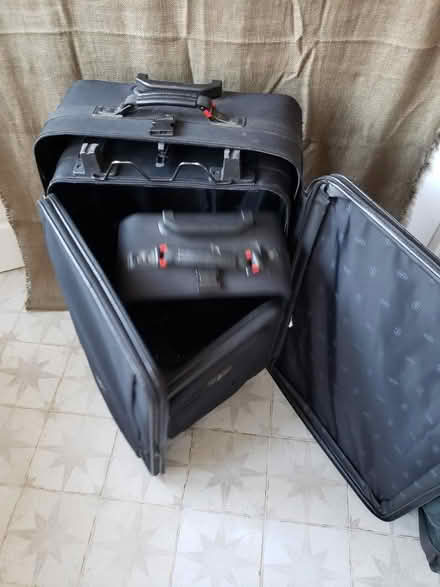 Photo of free 3 nesting rolling suitcases (Petworth) #2