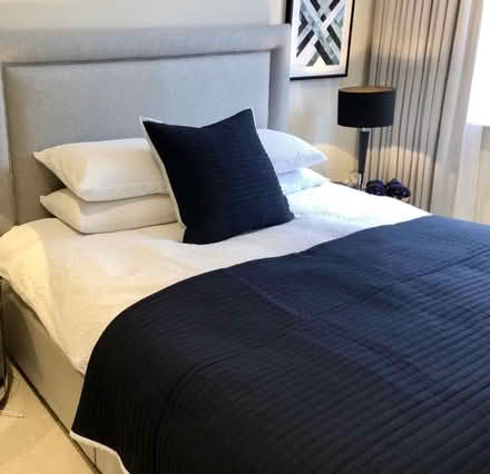 Photo of free Navy bed throw and matching cushion from DUSK (Pimlico SW1W) #1