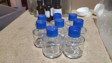 Photo of free 1 oz. glass bottles with caps (Table Mesa) #1