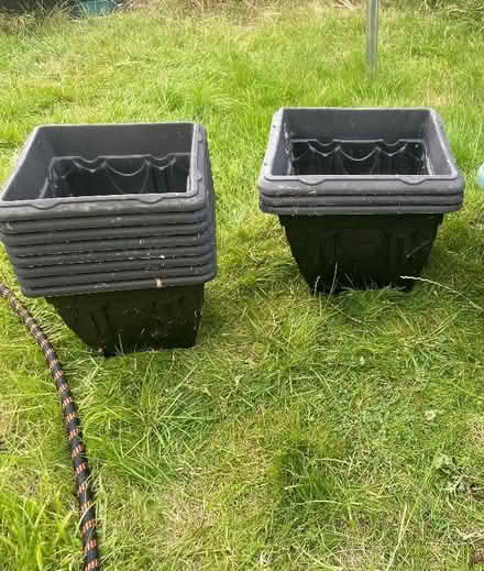 Photo of free Black planters and 1 green self watering planter (Orton Centre) #1