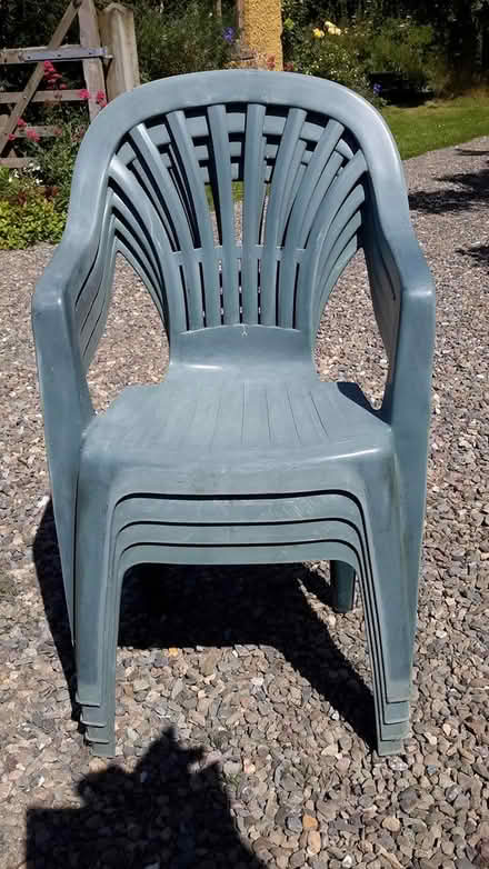 Photo of free 4 green plastic garden chairs (Bishop's Castle SY9) #1