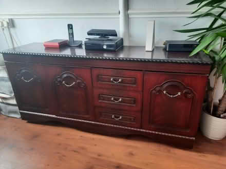 Photo of free Dark wood sideboard/TV unit (ME20) #1