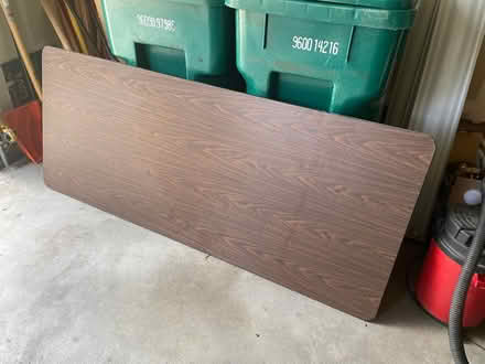 Photo of free Brown folding table - 6' x 2.5' (Near 115th & Sheridan) #1