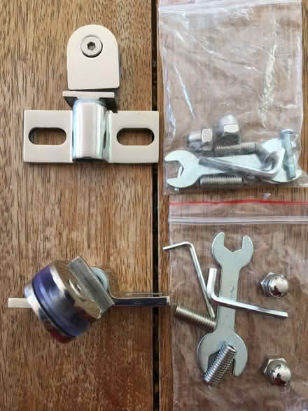 Photo of free 2 new pivot glass door hinges (Stroud Green N4) #1