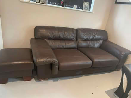 Photo of free 3 seater brown leather sofa plus footstool (Wigston LE18) #1