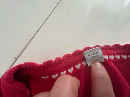 Photo of free 2 red school cardigans age 4 (Withington M20) #2