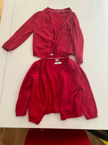 Photo of free 2 red school cardigans age 4 (Withington M20) #1