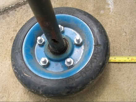 Photo of free 2 wheels approx. 19cms diameter & axle. Solid tyres (Upton Saint Leonards GL4) #1