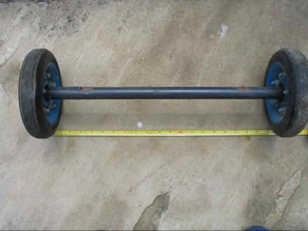 Photo of free 2 wheels approx. 19cms diameter & axle. Solid tyres (Upton Saint Leonards GL4) #2
