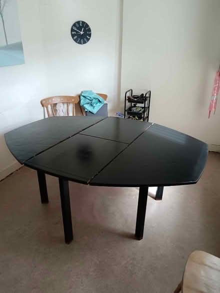 Photo of free Large extendedable solid wooden table. Been painted black (Cainscross GL5) #1