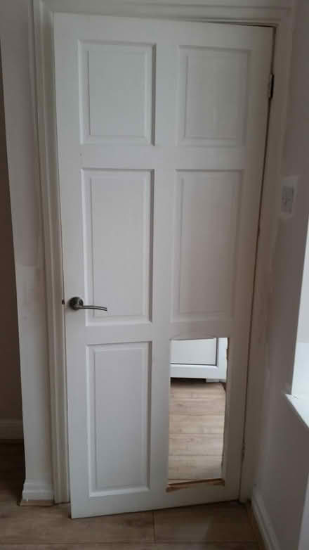 Photo of free Damaged white door (North Reddish Stockport) #2