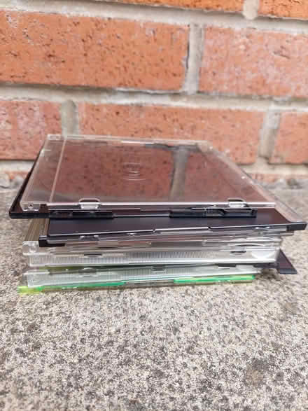 Photo of free Stack of empty CD cases (Cheadle Heath SK8) #1