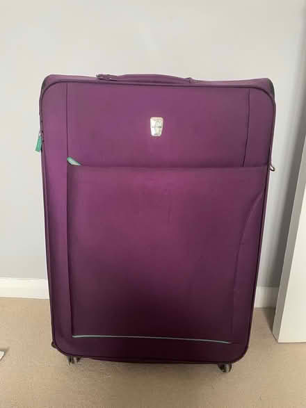 Photo of free Large purple suitcase (SW11 1EG) #1