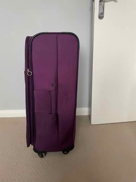 Photo of free Large purple suitcase (SW11 1EG) #3