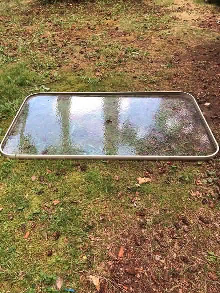 Photo of free Outdoor glass table top (no base) (Kenmore) #1