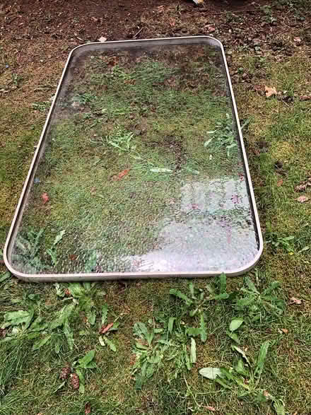 Photo of free Outdoor glass table top (no base) (Kenmore) #2