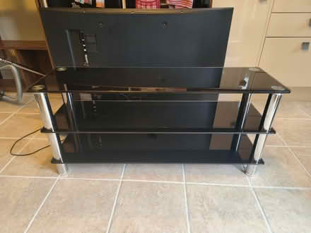 Photo of free Black glass TV stand (Mereworth ME18) #1